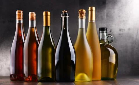 Composition with bottles different sorts of wine. Stock Photos