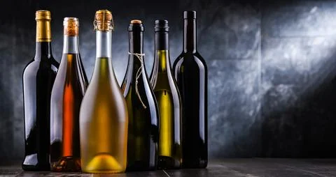 Composition with bottles of different sorts of wine. Stock Photos