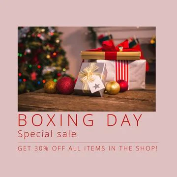 Composition of boxing day sales text over christmas presents and decorations Stock Photos