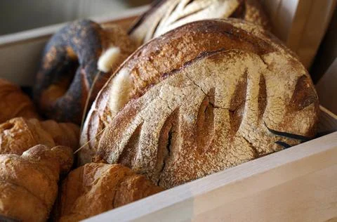 Composition with bread and rolls in  basket Stock Photos