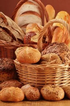Composition with bread and rolls in wicker basket Stock Photos