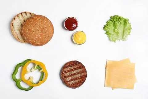 Composition with burger ingredients on white background, top view Stock Photos