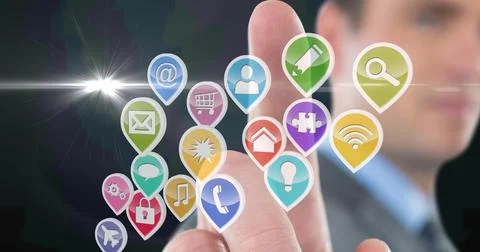 Composition of businessman touching screen with digital colouruful icons Stock Photos