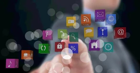 Composition of businessman touching screen with digital colourful icons Stock Photos