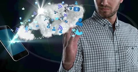 Composition of businessman using interactive screen with smartphone, cloud and Stock Photos