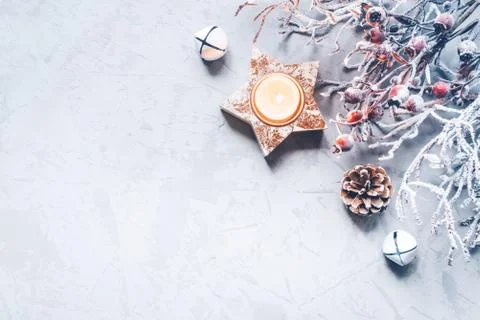 A composition of candlesticks, snow branches and Christmas decorations. Stock Photos