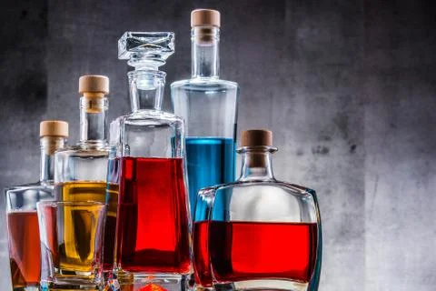 Composition with carafe and bottles of assorted alcoholic beverages. Stock-Fotos