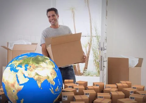 Composition of cardboard boxes with globe, man carrying box, unpacking in new 스톡 사진