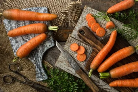 Composition with  carrots on rustic  background. Top view. Stock Photos
