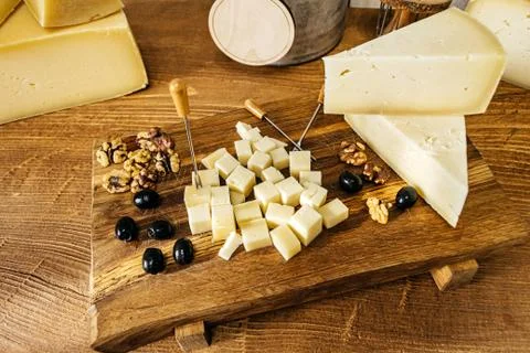 Composition of cheese cubes on a wooden table Stock Photos