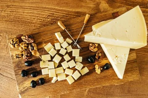Composition of cheese cubes on a wooden table closeup Stock Photos