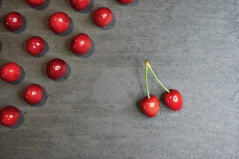 Composition of cherries on a black stone background Stock Photos