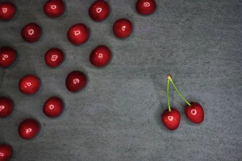 Composition of cherries on a black stone background Stock Photos
