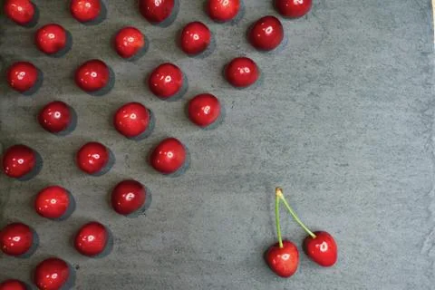 Composition of cherries on a black stone background Stock Photos