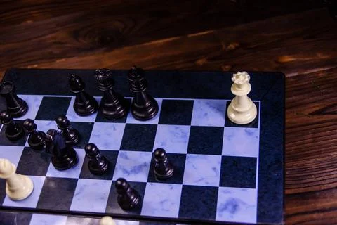 Composition of the chess pieces on a chess board Stock Photos