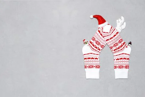Composition of Christmas white wool socks, deer horns, hat and snowmen on a g Stock Photos