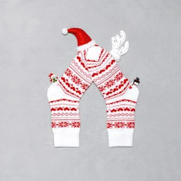 Composition of Christmas white wool socks, deer horns, hat and snowmen on a g Stock Photos
