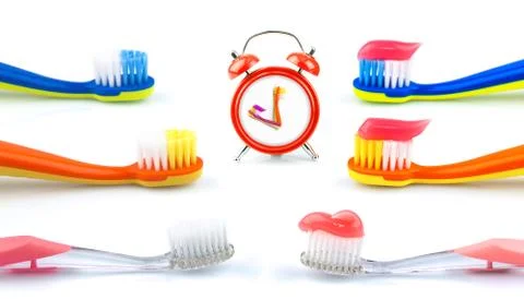Composition from clock, color toothbrushes with toothpaste, set Stock Photos