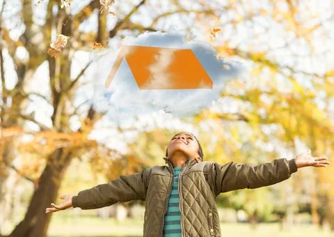 Composition of cloud with graduation hat icon over happy african american boy in Foto stock