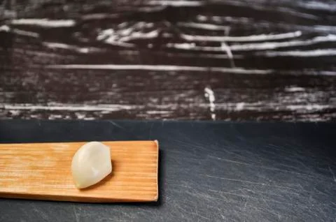 A composition of cloves of garlic on the table. Healthy eating. Stock Photos