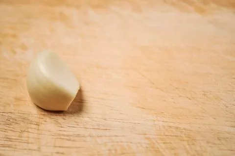 A composition of cloves of garlic on the table. Healthy eating. Stock Photos