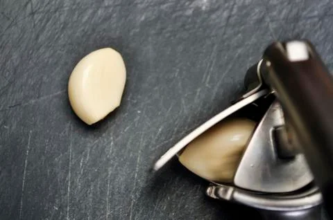 A composition of cloves of garlic on the table. Healthy eating. Stock Photos
