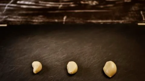 A composition of cloves of garlic on the table. Healthy eating. Stock Photos