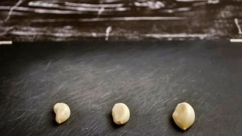A composition of cloves of garlic on the table. Healthy eating. Stock Photos