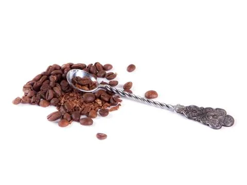 Composition of coffee beans and a spoon Stock Photos