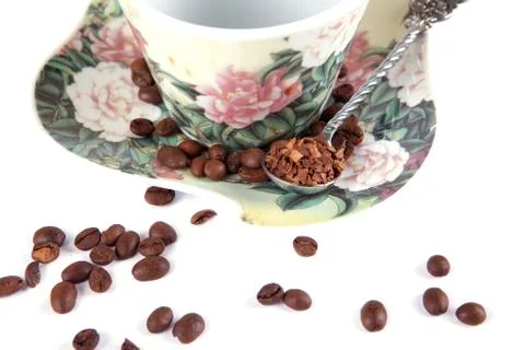 Composition of coffee beans, cups and spoons Stock Photos