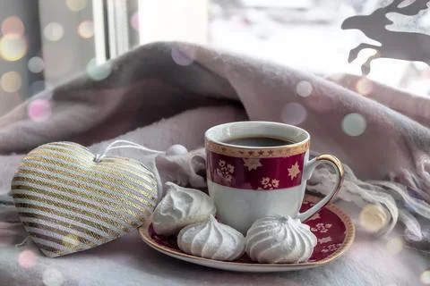Composition of coffee in a red mug and marshmallows on a saucer Stock Photos