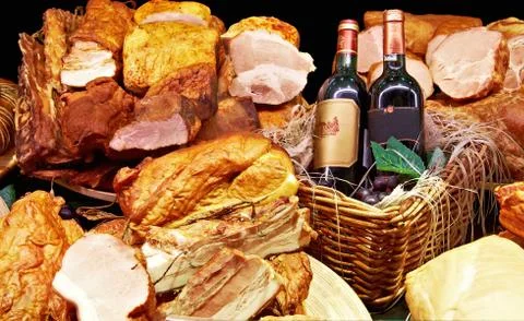 A composition of cold meat with wine bottles Stock Photos