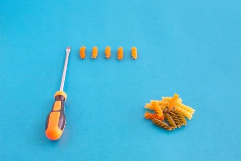 Composition of colored spirals and screwdriver on eye-catching background Stock Photos