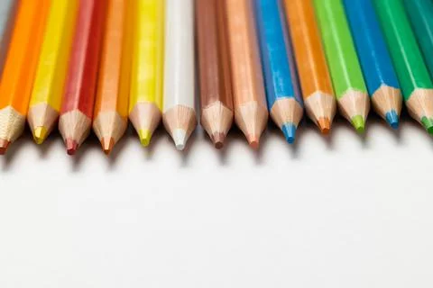 Composition of colorful crayons on white surface with copy space Stockfoto's