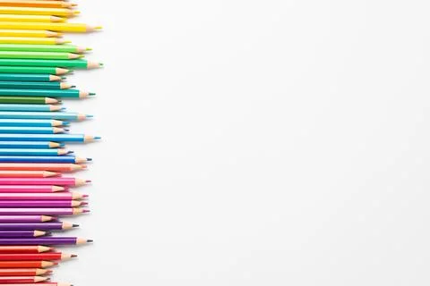 Composition of colorful crayons on white surface with copy space Stockfoto's