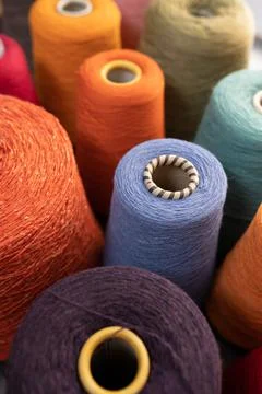 Composition of colorful vibrant wool threads from above. Stock Photos