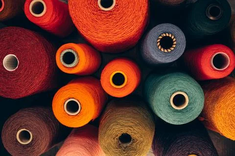 Composition of colorful vibrant wool threads from above. Stock Photos
