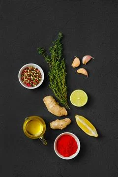 Composition with condiments on black background Foto stock