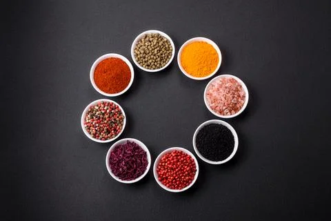 Composition consisting of a variation of several types of spices in white cer Stock-Fotos