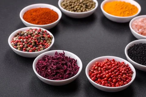 Composition consisting of a variation of several types of spices in white cer Stock Photos