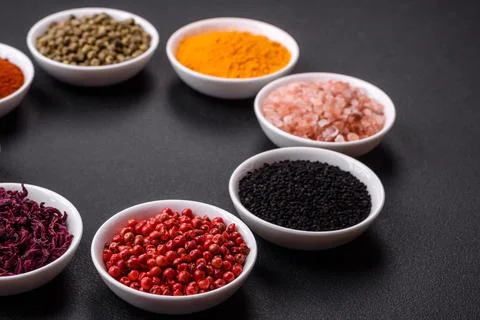 Composition consisting of a variation of several types of spices in white cer Stock Photos