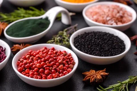 Composition consisting of a variation of several types of spices in white cer Stock Photos