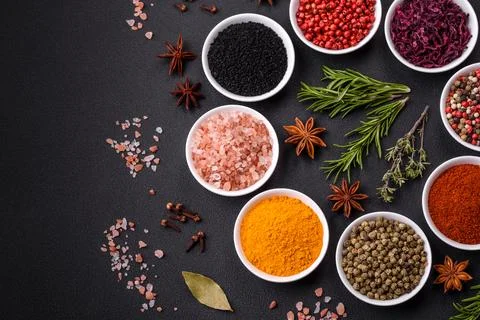 Composition consisting of a variation of several types of spices in white cer Stock Photos