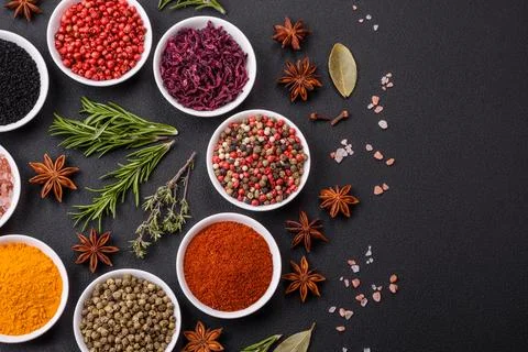 Composition consisting of a variation of several types of spices in white cer Stock Photos