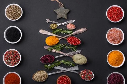 Composition consisting of a variation of spices in metal spoons laid out in.. Stock Photos