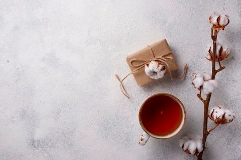 Composition with cotton branch and tea Stock Photos