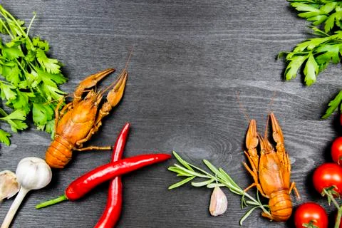 Composition with crayfish, pepper, garlic, tomatoes, dill, parsley, pickled c Stock Photos