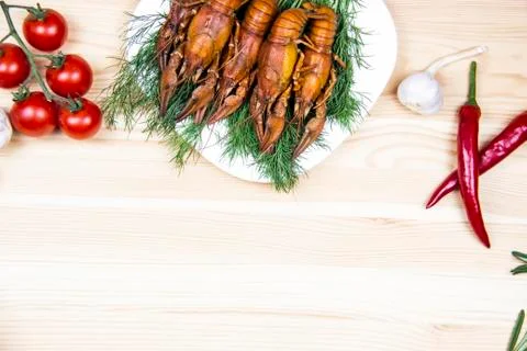 Composition with crayfish on the white plate, pepper, tomatoes, garlic, dill  Stock Photos