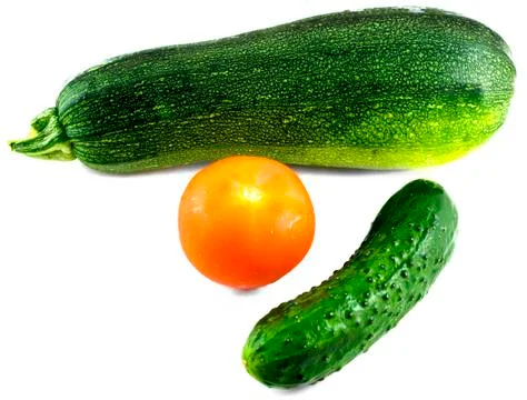 Composition from cucumber, tomato and vegetable marrow isolated on white Stock Photos