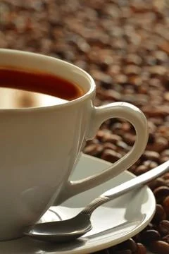 Composition with cup and coffee beans Composition with cup and coffee bean... Stockfoto's
